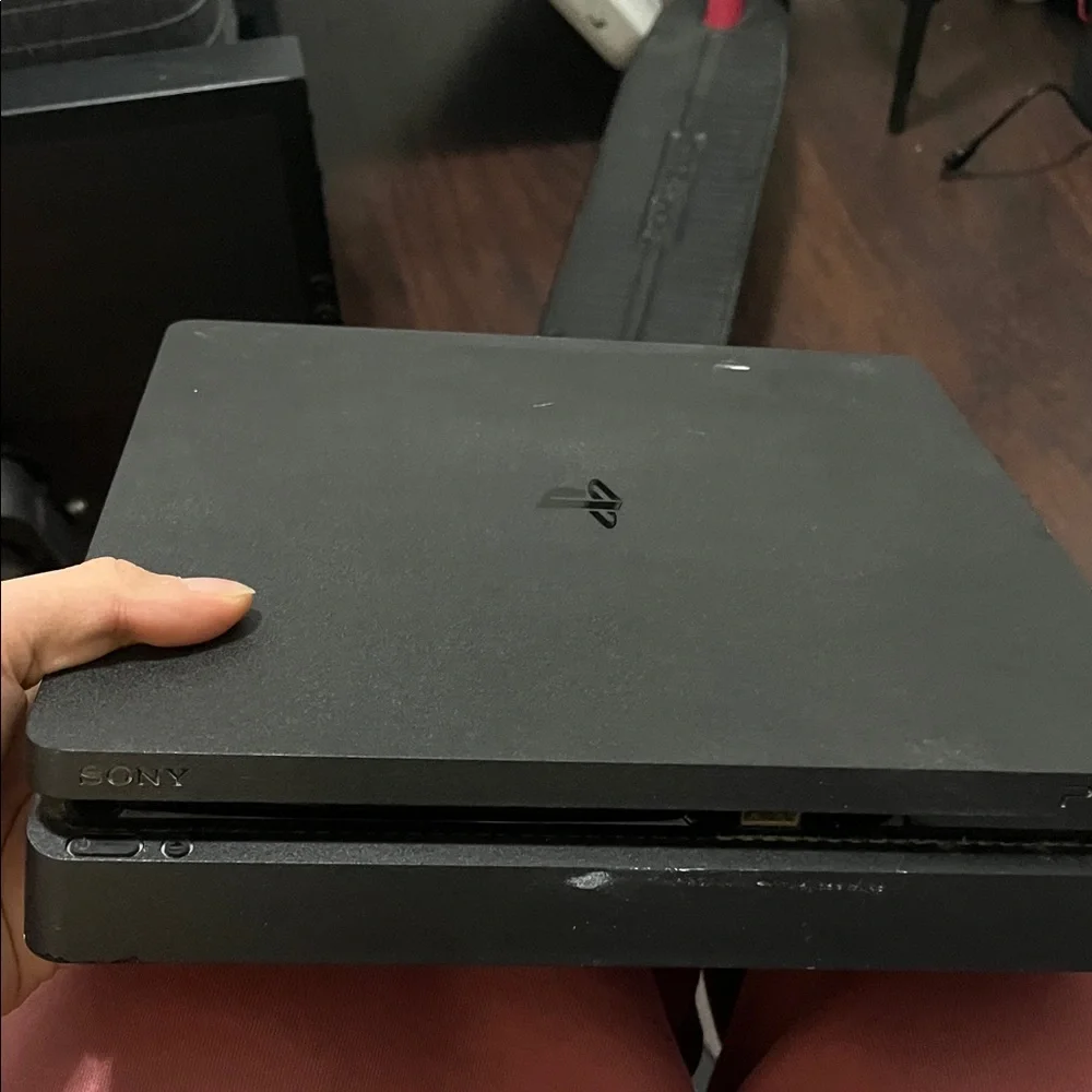 Sony PlayStation 4 Console with Black and Blue Controllers